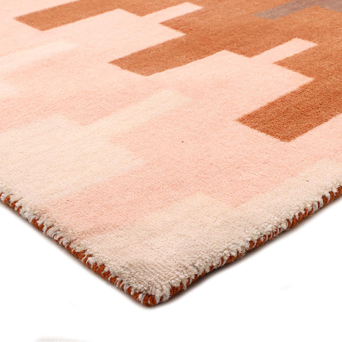 Luxury handcrafted designer rug in a modern living room by Floored Homes